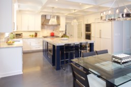 jwh white and navy kitchen with concrete floor