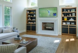 Contrasting black and white oak cabinets.