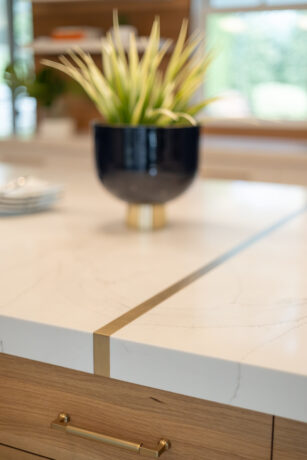 satin brass detail by JWH joins extra long countertops