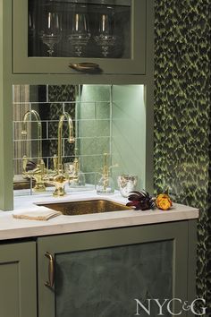 JWH Custom Cabinetry is highlighted by a bold wallpaper choice.